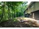 A spacious backyard area with lush greenery surrounds a charming home at 5213 Tomahawk Trl, Raleigh, NC 27610