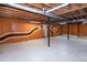 Partially finished basement featuring unique painted walls and exposed ceiling at 5213 Tomahawk Trl, Raleigh, NC 27610