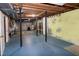 Unfinished basement featuring black support poles and a painted concrete floor at 5213 Tomahawk Trl, Raleigh, NC 27610