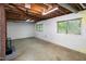 Unfinished basement with exposed ceiling and natural light at 5213 Tomahawk Trl, Raleigh, NC 27610