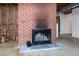 Basement with a brick fireplace at 5213 Tomahawk Trl, Raleigh, NC 27610