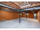 Basement featuring painted walls and exposed beams with natural light at 5213 Tomahawk Trl, Raleigh, NC 27610
