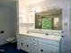 Bathroom with double sinks, vanity, and ample storage at 5213 Tomahawk Trl, Raleigh, NC 27610
