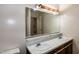 Bright bathroom with dual sinks, a large mirror, and neutral decor at 5213 Tomahawk Trl, Raleigh, NC 27610
