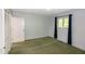 Bedroom featuring a window with dark curtains and a closet with folding doors at 5213 Tomahawk Trl, Raleigh, NC 27610