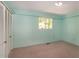 Light-filled bedroom with closet and window providing ample natural light at 5213 Tomahawk Trl, Raleigh, NC 27610