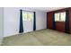 Bright bedroom featuring two large windows dressed with dark curtains, and a neutral wall color at 5213 Tomahawk Trl, Raleigh, NC 27610