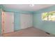 Cozy bedroom with double closet and window providing ample natural light at 5213 Tomahawk Trl, Raleigh, NC 27610