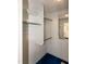 Walk-in closet with custom shelving and hanging rods at 5213 Tomahawk Trl, Raleigh, NC 27610