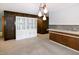 Dining area with built in cabinets and counter, open to kitchen at 5213 Tomahawk Trl, Raleigh, NC 27610