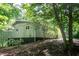 A home's exterior with siding and trees adding natural beauty to the landscape around the residence at 5213 Tomahawk Trl, Raleigh, NC 27610