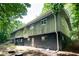 View of the side and back of the home, showing several windows at 5213 Tomahawk Trl, Raleigh, NC 27610