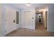 Bright foyer with closet and tiled entry, leading to additional rooms at 5213 Tomahawk Trl, Raleigh, NC 27610