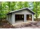 A detached garage featuring two bays with open doors at 5213 Tomahawk Trl, Raleigh, NC 27610