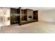 Spacious living area with a unique brick fireplace and access to the kitchen at 5213 Tomahawk Trl, Raleigh, NC 27610
