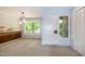 Living room with view of the kitchen and front entrance at 5213 Tomahawk Trl, Raleigh, NC 27610
