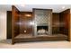 Cozy living room with a brick fireplace and wood paneling, creating a warm and inviting space at 5213 Tomahawk Trl, Raleigh, NC 27610