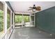 Inviting screened porch with a ceiling fan, perfect for enjoying the outdoors comfortably at 5213 Tomahawk Trl, Raleigh, NC 27610
