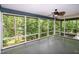 Relaxing screened porch surrounded by lush greenery offering a tranquil outdoor space at 5213 Tomahawk Trl, Raleigh, NC 27610