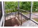 Wrought iron staircase leading from screened porch to backyard at 5213 Tomahawk Trl, Raleigh, NC 27610