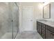 Modern bathroom with a glass-enclosed shower and vanity with granite countertop at 565 Joseph Alexander Dr, Fuquay Varina, NC 27526
