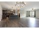 Open-concept kitchen with gray cabinets, granite countertops, and stainless steel appliances at 565 Joseph Alexander Dr, Fuquay Varina, NC 27526