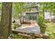 An inviting backyard featuring a spacious deck, perfect for outdoor living and entertaining in a serene setting at 5704 Cholderton Ct, Raleigh, NC 27604