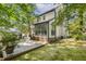 An exterior view of a home with a large, inviting deck for outdoor relaxation and entertainment at 5704 Cholderton Ct, Raleigh, NC 27604