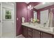 Stylish bathroom with double vanity, framed mirror and modern fixtures providing a luxurious and functional space at 5704 Cholderton Ct, Raleigh, NC 27604