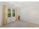 Bright bedroom with neutral carpet, ample natural light, and a charming window view for a warm ambiance at 5704 Cholderton Ct, Raleigh, NC 27604