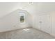 Bright bedroom featuring plush carpet, natural light and a double door closet at 5704 Cholderton Ct, Raleigh, NC 27604