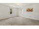 Bright and airy bedroom with plush carpeting, natural light, and freshly painted white walls at 5704 Cholderton Ct, Raleigh, NC 27604