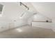 Expansive bonus room featuring plush carpet, recessed lighting and an additional stairway at 5704 Cholderton Ct, Raleigh, NC 27604