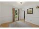 Bright dining room with hardwood floors, wainscoting, large window, and elegant trim at 5704 Cholderton Ct, Raleigh, NC 27604