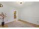 Hardwood dining room featuring wainscoting with connecting views to the home's kitchen at 5704 Cholderton Ct, Raleigh, NC 27604
