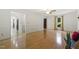 Open-concept living room boasts hardwood floors, crown molding, and seamless flow to other living areas at 5704 Cholderton Ct, Raleigh, NC 27604
