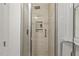 Elegant walk-in shower featuring glass door and handrails, providing a luxurious and accessible bathing experience at 5704 Cholderton Ct, Raleigh, NC 27604