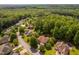 An aerial view of a neighborhood with well-maintained homes surrounded by lush green trees and landscaping at 60 Morning Mist Dr, Garner, NC 27529