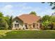 Lovely backyard features outdoor dining and lounge areas, mature trees, and a well-maintained lawn at 60 Morning Mist Dr, Garner, NC 27529