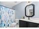 Bathroom featuring a vanity with a decorative mirror, a toilet, and a shower with a decorative shower curtain at 60 Morning Mist Dr, Garner, NC 27529