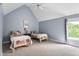 Cozy bedroom with vaulted ceilings, two twin beds, and a window offering natural light and views of the outdoors at 60 Morning Mist Dr, Garner, NC 27529