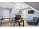 Bright home office featuring a ceiling fan, desk, comfortable seating, and natural light streaming through the window at 60 Morning Mist Dr, Garner, NC 27529