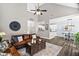 An expansive living room offering open layout, hardwood floors, vaulted ceiling, and comfortable furnishings at 60 Morning Mist Dr, Garner, NC 27529