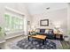 Comfortable living room with neutral paint, shutters, hardwood floors, and elegant furnishings at 60 Morning Mist Dr, Garner, NC 27529