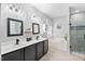 Main bathroom featuring double sink vanity, soaking tub and glass enclosed shower at 60 Morning Mist Dr, Garner, NC 27529