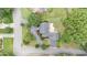 An aerial view of a home with a patio and driveway in a landscaped yard at 600 Driftwood Dr, Gibsonville, NC 27249