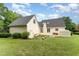 Exterior shot of house with a patio and a hot tub in the backyard at 600 Driftwood Dr, Gibsonville, NC 27249
