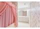 Hall bathroom featuring floral wallpaper and a shower with pink curtains at 600 Driftwood Dr, Gibsonville, NC 27249