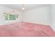 Spacious bedroom featuring soft pink carpet and a bright window nook at 600 Driftwood Dr, Gibsonville, NC 27249