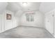 Bedroom featuring grey carpet, a window with drapes and two closets at 600 Driftwood Dr, Gibsonville, NC 27249